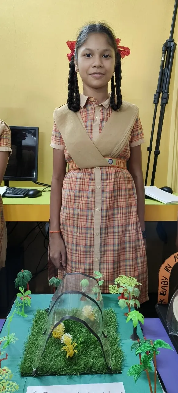 Science exhibition — a student with a model.